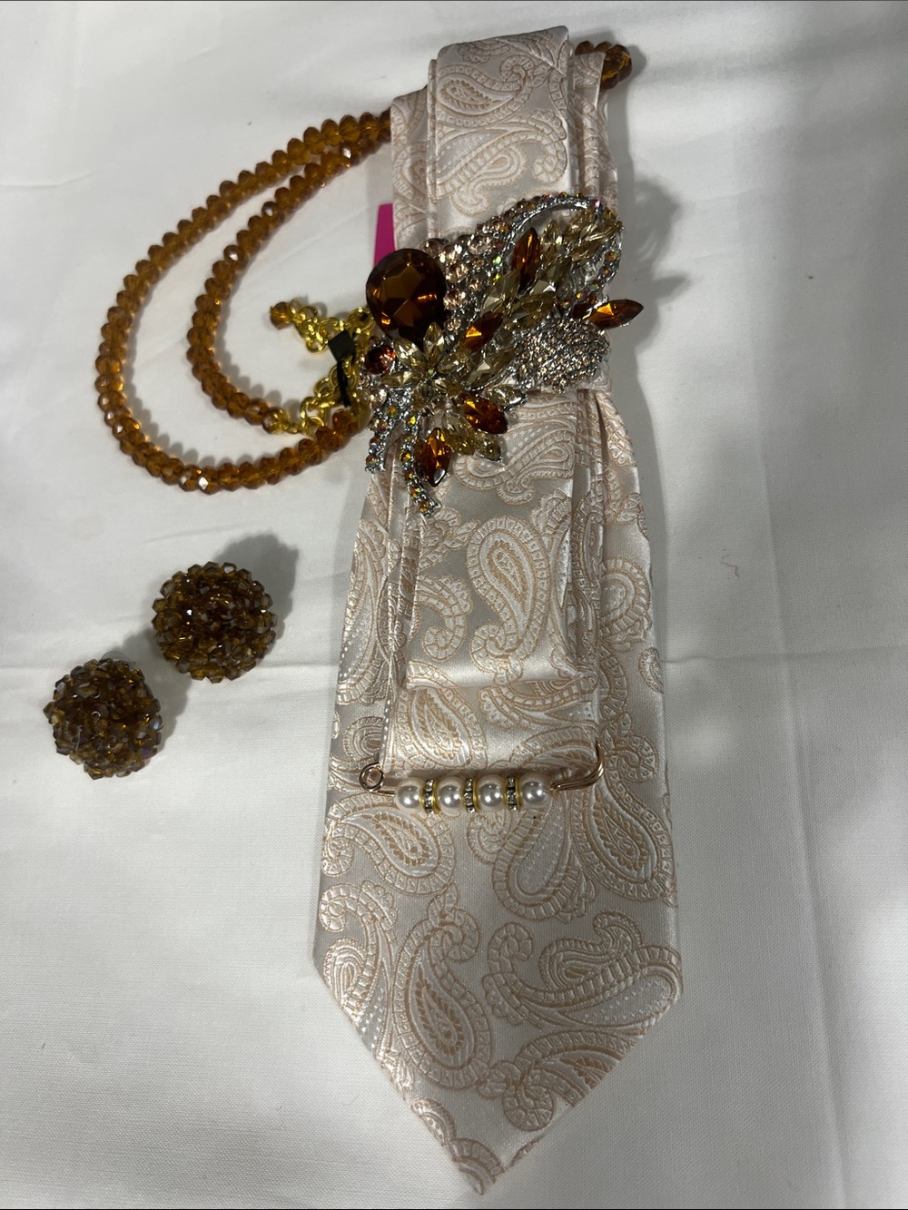 Elegant Cream Paisley Tie  Necklace with Amber Crystal Brooch